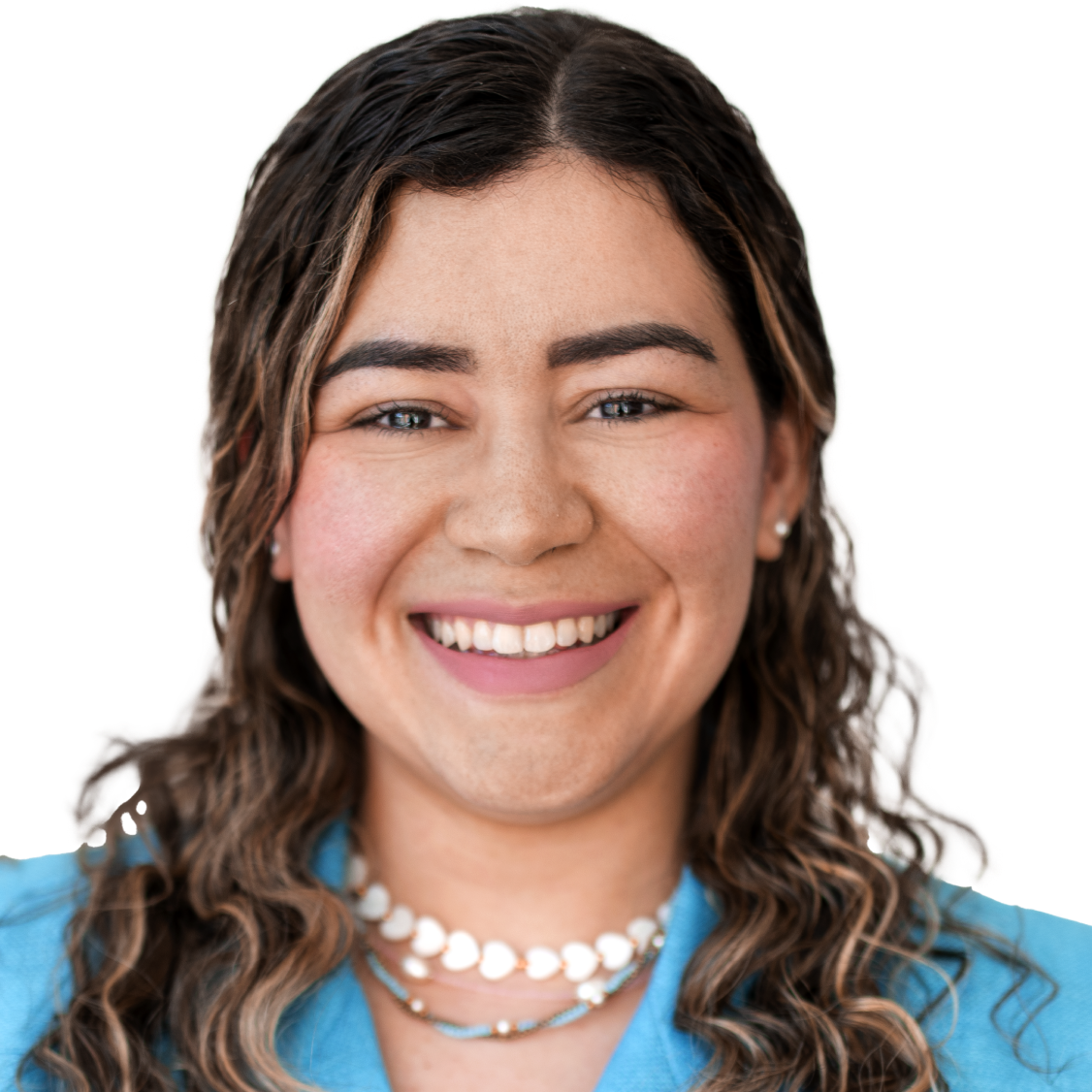 A smiling woman with curly hair wearing a blue blazer.